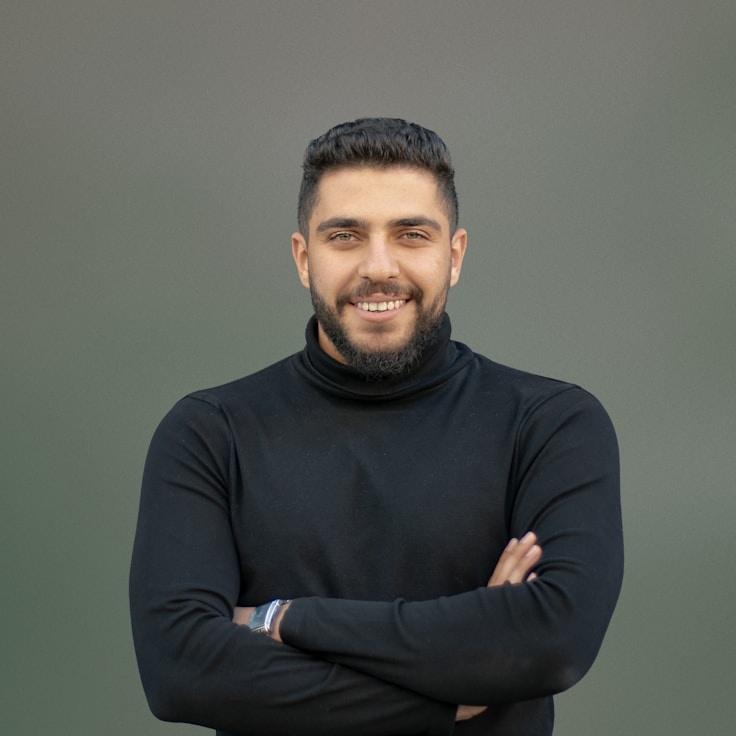 Kaveri Mehta, Lead Design Curator at LoftCurrentWorks, reviewing corporate floral arrangements